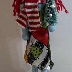 Disney Nightmare Before Christmas Nutcracker / Santa Hat Sally Holding Present