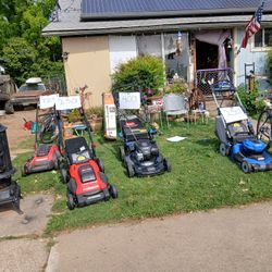 3 brand new lawn mowers.