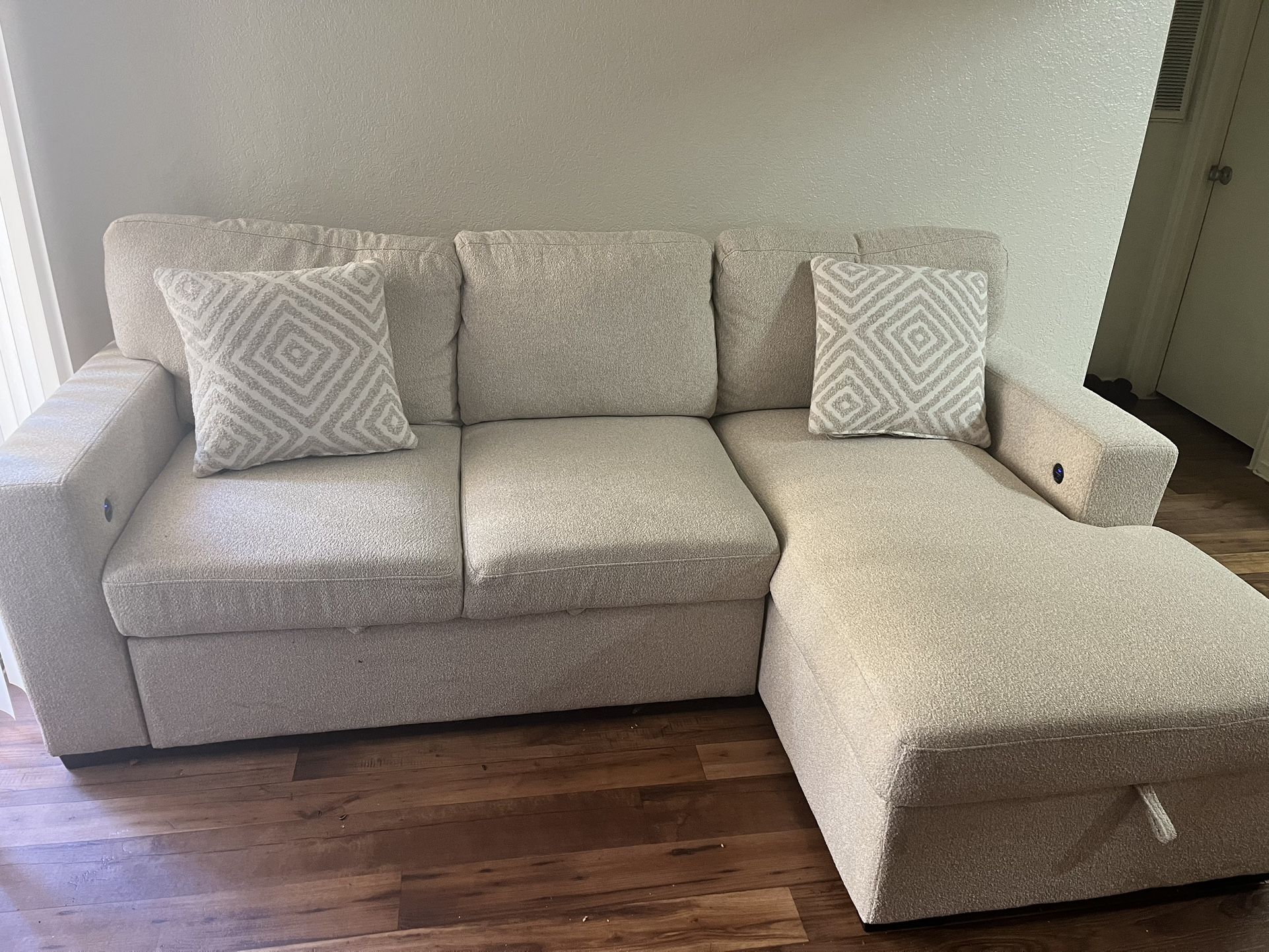 Beige Couch With Storage And Pullout And Charger