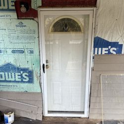 Door With Casing And Storm Full View And Sink Faucet