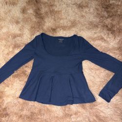 Navy blue long sleeve top with peplum hem