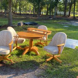 Dining Table With Four Rolling Chairs