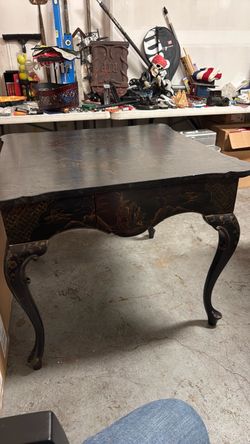 Table 36 x 36”Chinoiserie Game Table C. 1940s Black lacquer chinoiserie game tables. Graceful cabriole legs with continuous decorative...
