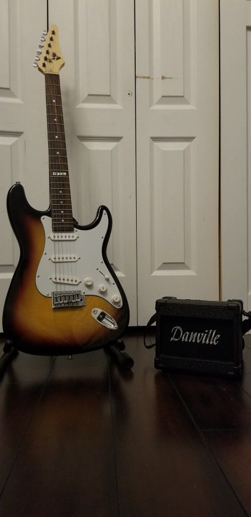 MVG Electric Guitar With Amp And Stand