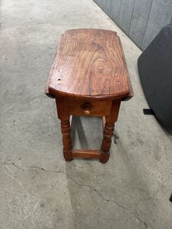 Wood drop-leaf table with drawer