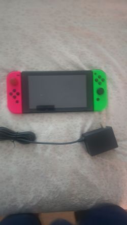 Nintendo Switch with Neon Pink and Green Joy-Cons