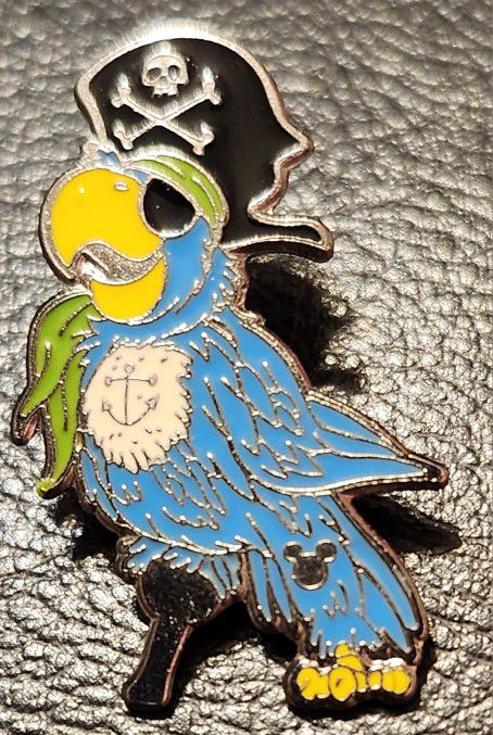 Shanghai Disney Resort Hidden Mickey Pirates of the Carribean Blue Parrot Green Scarf Disney Trading Pin released 2008. In mint condition