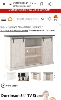 TV STAND FROM ASHLEY'S IN BOX NEVER OPENED