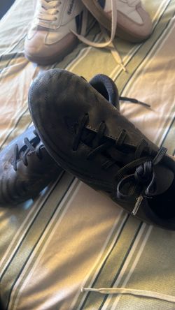 Soccer cleats size 12 and one vans are Hunter Green
