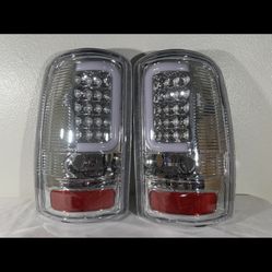 2000 to 2006 GMC Yukon / Chevy Suburban Pair of Chrome Housing Clear Lens 3D LED Brake Tail Lights