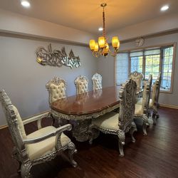 Elegant Dining Table with 8 Chairs – $5000  