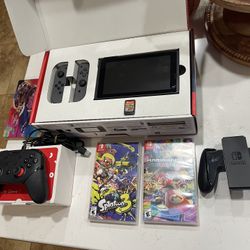 Great Nintendo Switch bundle. Includes the console with gray Joy-Cons, a Joy-Con grip, and a black pro controller. Also comes with three games: Minecr