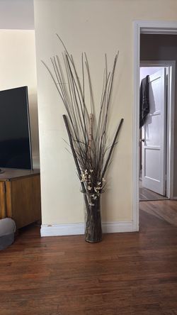 Glass vase and sticks flowers