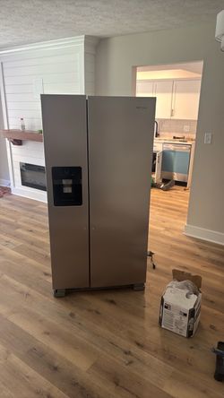 Brand New. Never UsesWhirlpool Side-by-Side Refrigerator with Ice Dispenser