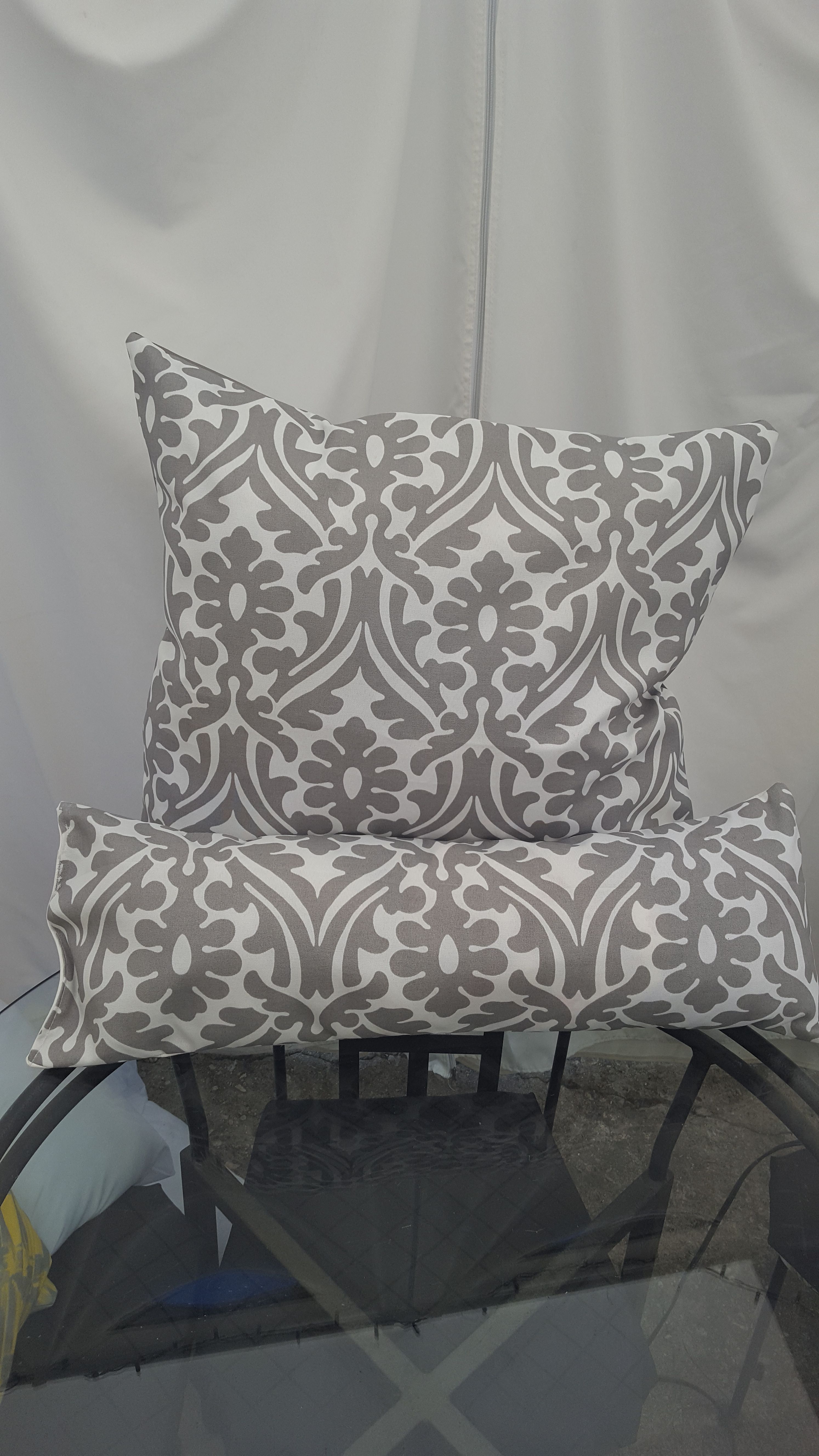 Brand new indoor/outdoor grey and white pillows!