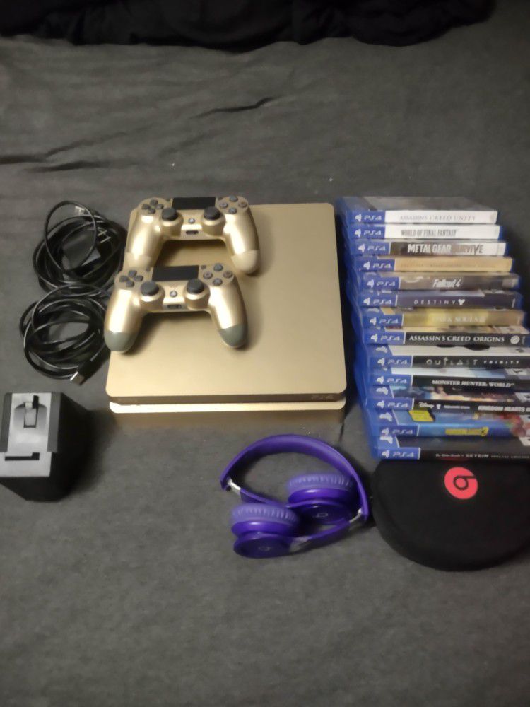 Gold Slim Ps4 1Tb, 2 controllers w 2 10ft cords, nyko charging dock, Beats solo headphones and 13+ games