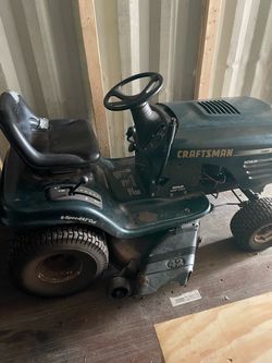Two craftsmen mowers older and newer generations
