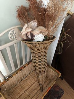 Two wicker baskets and metal chair