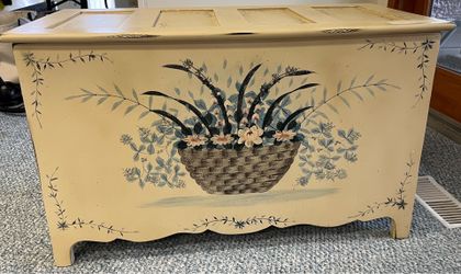 Painted storage chest with floral basket design