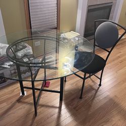 Glass Table 2chairs Four Pictures And One Vase