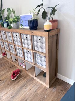 Free shelf and storage bins read below