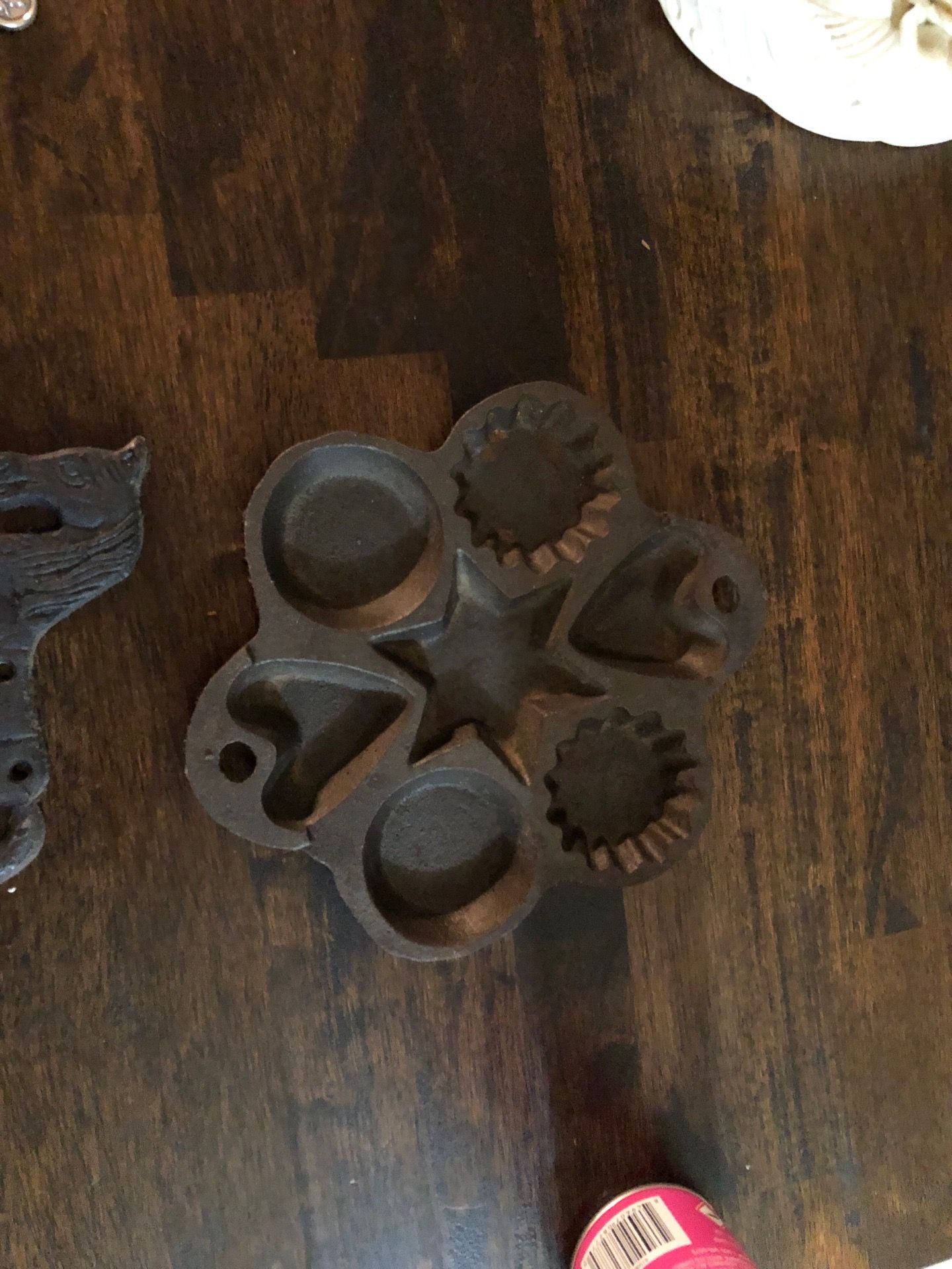 vintage cast iron kitchen utensil set with a decorative rocking horse wall rack