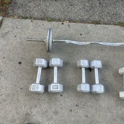 One Set Of 20lbs, One Set Of 15lbs, One Set Of 12lbs, And 40lb Weight Plates With Bar