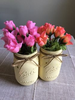 Distressed mason jar vases with flowers included! $10 for both