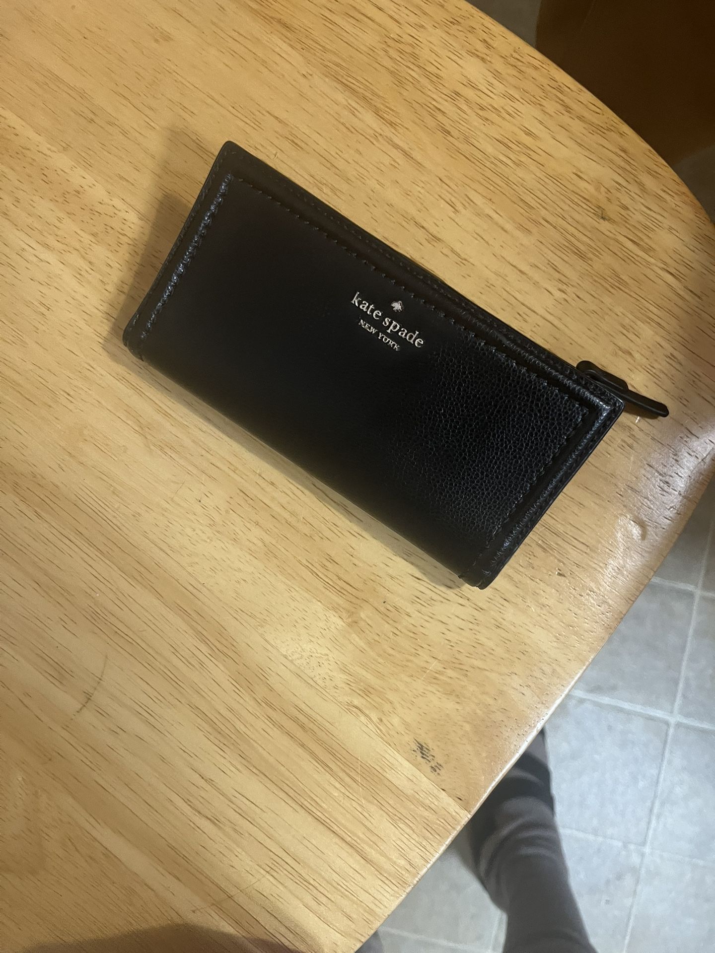 Black Kate Spade New York wallet.