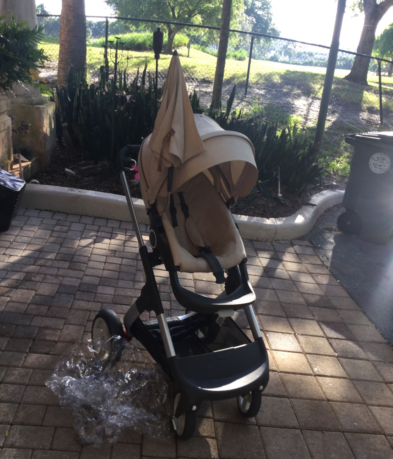 Used Stokke stroller with accessories.