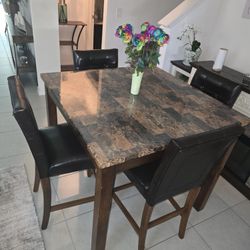 Faux marble top dining table with 4 Chairs leather. 