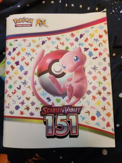 Pokemon card binder full of holographic cards and legendary pokemon