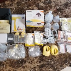 Electric Breast Pump w/ LOTS of Extra Accessories, Manual Breast Pump w/ Accessories, & Pumping Bra (2 pictures posted)