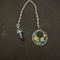 Dark Blue Crystal Sand  Pendulum In A Stainless Steel Chain.  