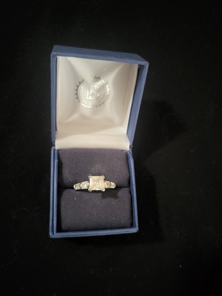 Gorgeous Bradford Exchange Silver Ring With Large Princess Cut Center Stone With Round Brilliant And Emerald Cut Accent Stones!