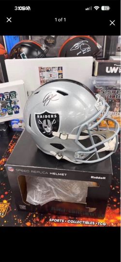 Full size Raiders helmet signed by Geno Smith