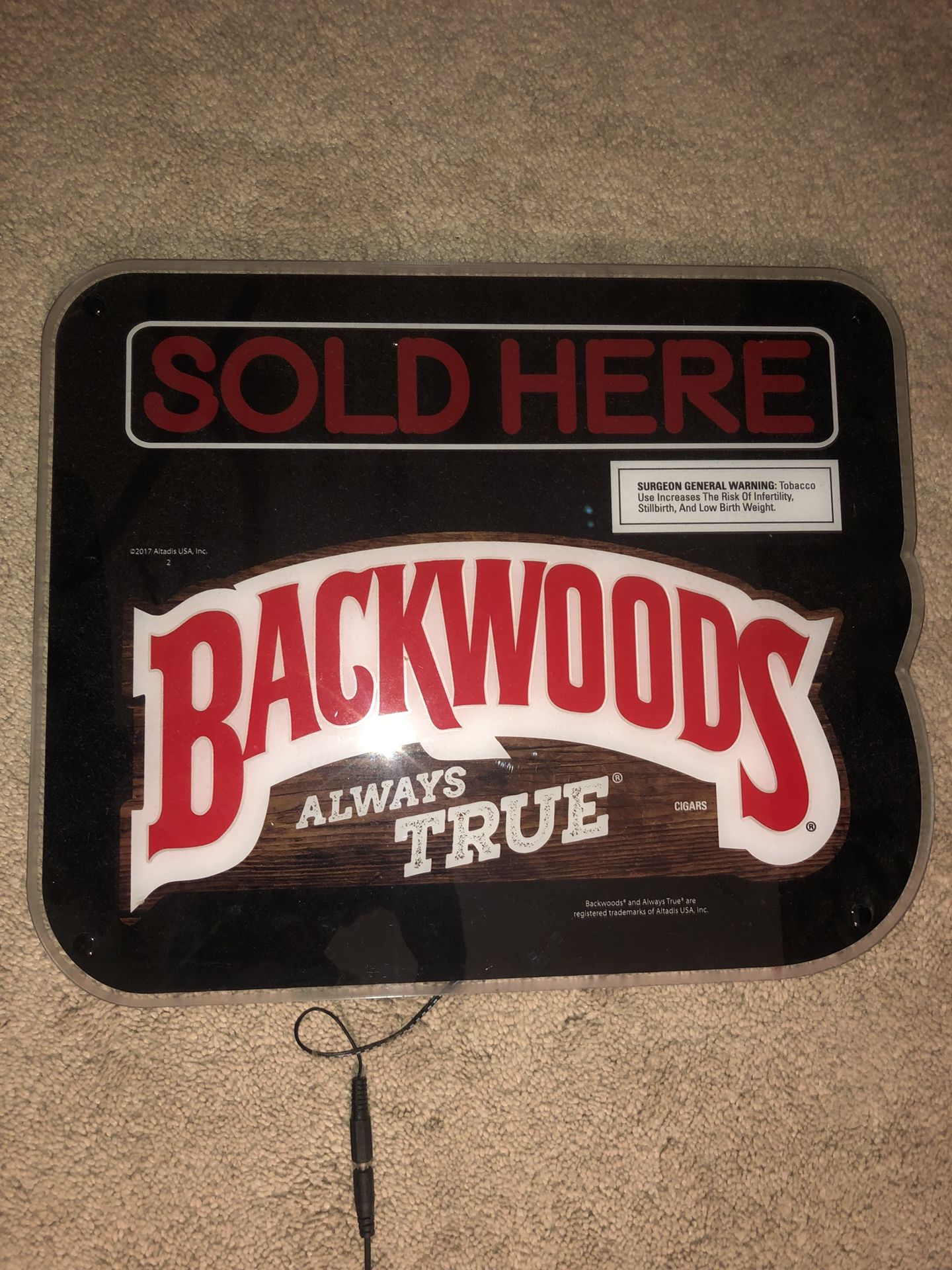 Neon backwoods sign