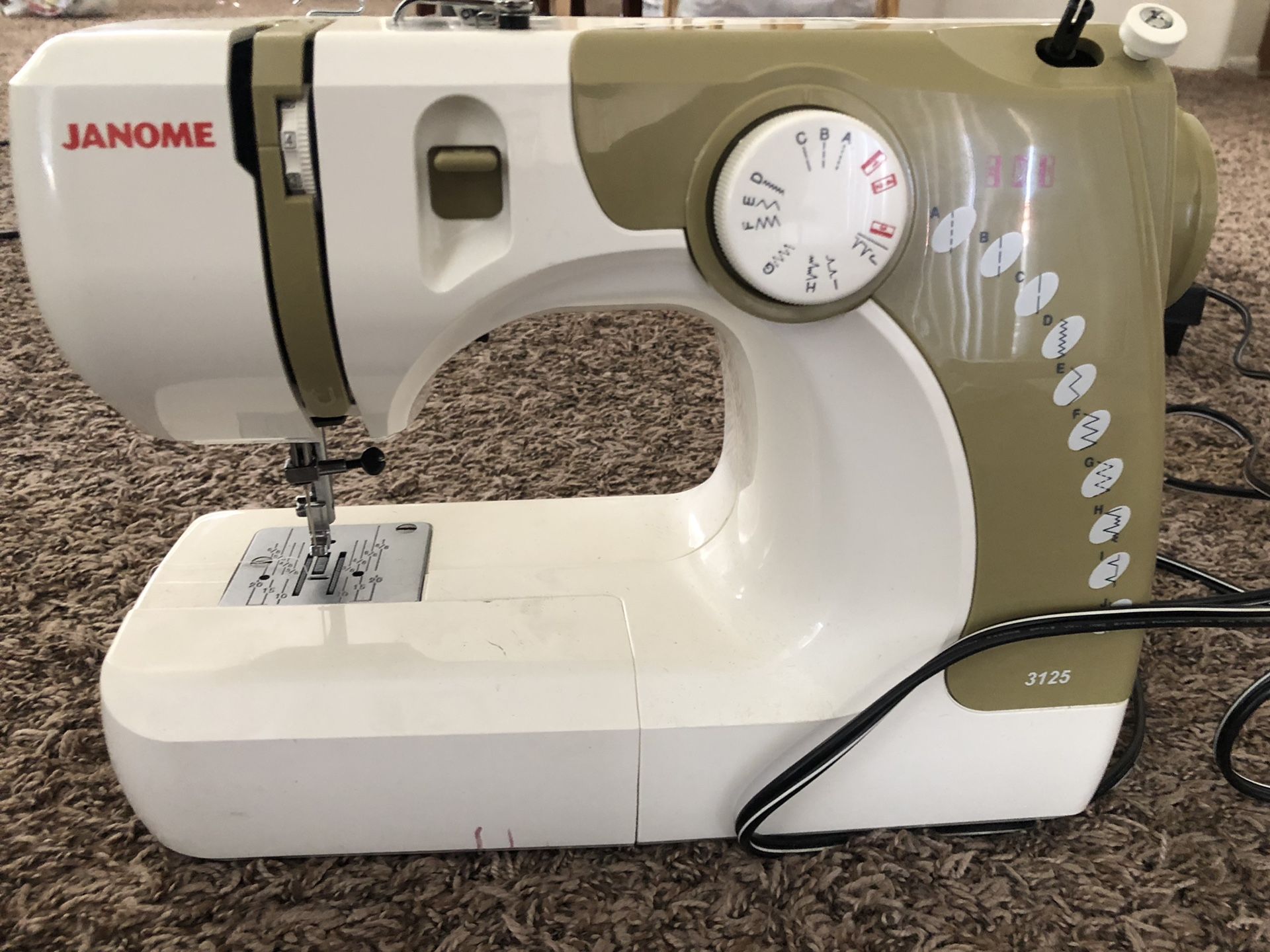 Janome Model 3125 sewing machine with accessories and cover for Sale in