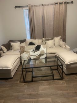 U shaped sectional, Table, curtains, and picture. Pillows included
