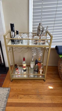 Gold bar cart and cocktail mixer