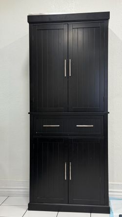 Modern black storage cabinet in excellent condition.