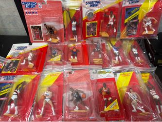 Lot of over 200 vintage pieces of new Starting Lineup action figures NBA MLB