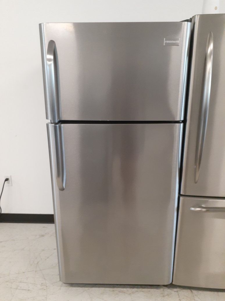 Frigidaire stainless steel top freezer refrigerator in good condition with 90 day's warranty