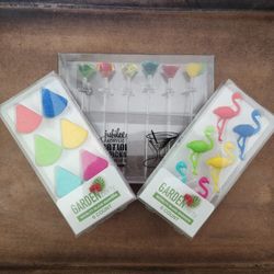 lot of Martini stir sticks and novelty drink markers