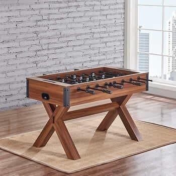 NEW IN THE BOX AMERICAN HERITAGE ARLINGTON FOOSBALL TABLE Features: Magnificent Cross Brace Leg Base Metal Rods with Ball Bearing Action Counter Bala