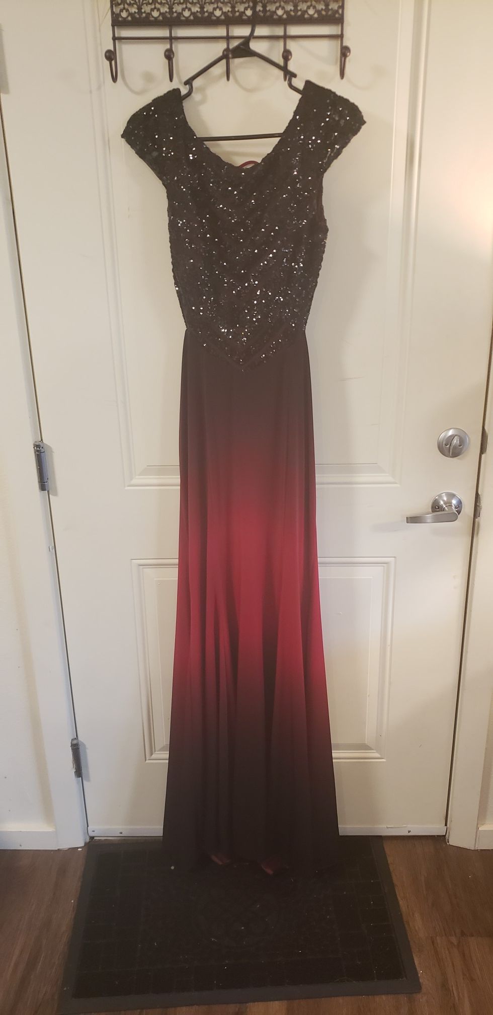 Size large red and black formal dress. Perfect condition. Worn once for prom.