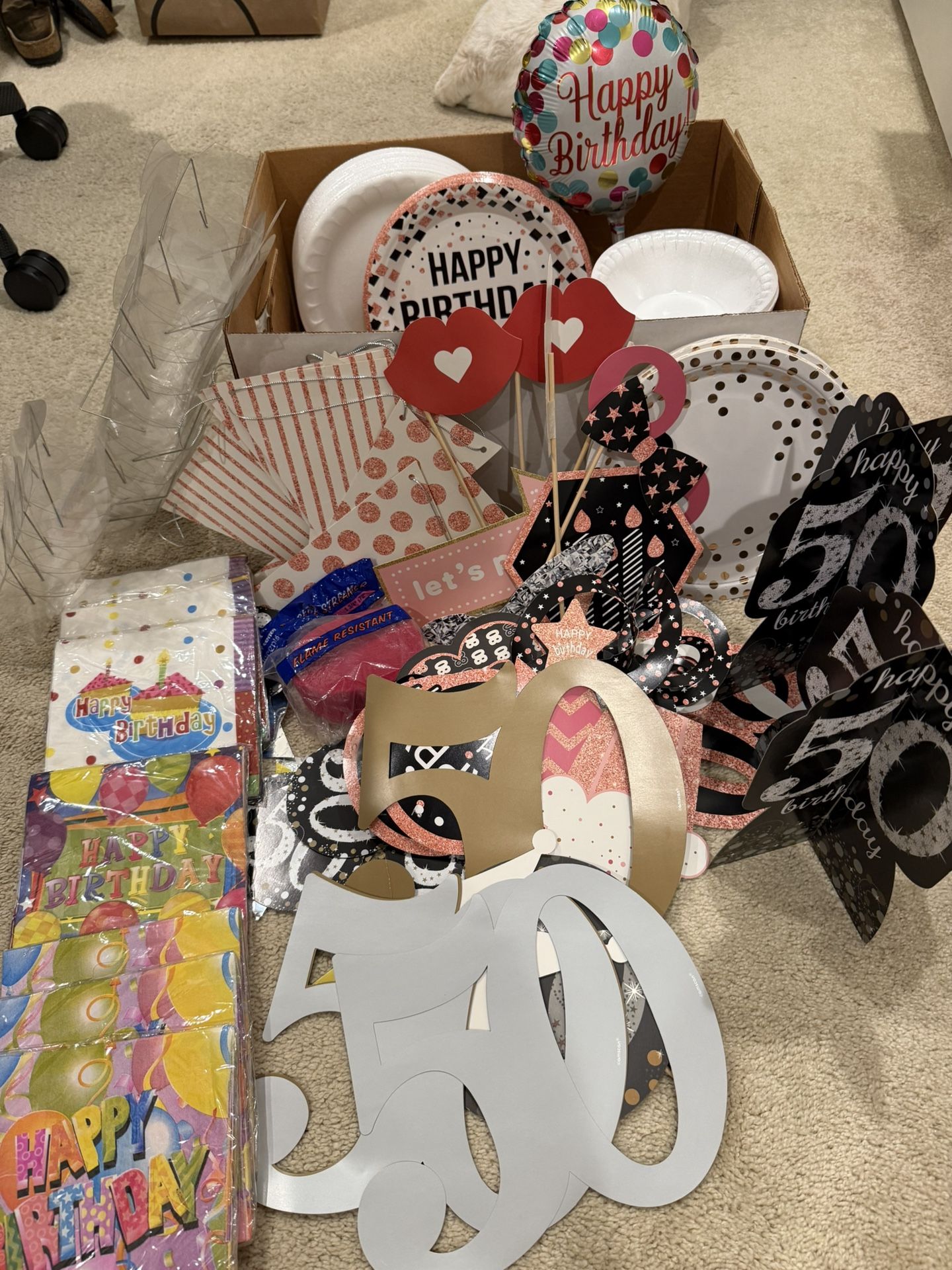 box full of party supplies decorations 