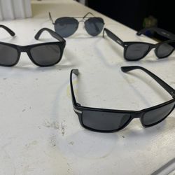 4 Pairs Of Dark Sunglasses 