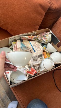 Set of white antique dinnerware with silver trim