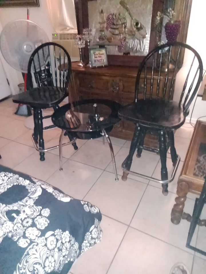Two Bar Stools And Glass Table
